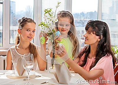Happy family with child hang easter egg Stock Photo
