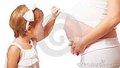 Happy family. Child hugs belly of pregnant mother Stock Photo