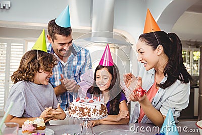 Happy family clapping during birthday celebration Stock Photo
