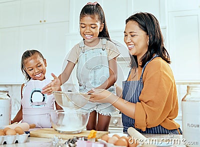 Happy family cooking, mother and children help mom with egg, wheat flour and bake food in home kitchen. Love, youth kids Stock Photo