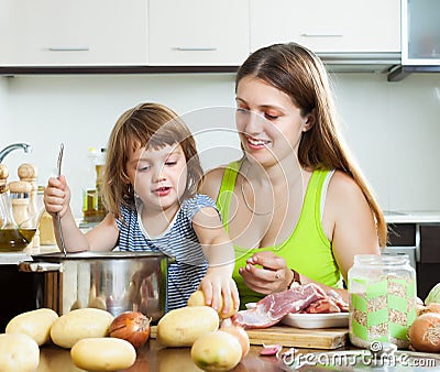 Happy family cooking soup Stock Photo