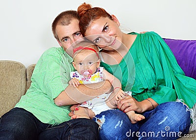Happy family couple with baby girl Stock Photo