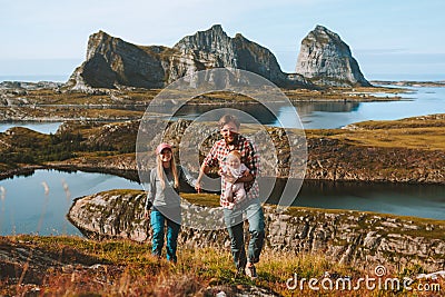 Happy family couple with baby mountain travel vacations outdoor Stock Photo