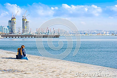 Happy family on the embankment. Mother and daughter look afar Editorial Stock Photo