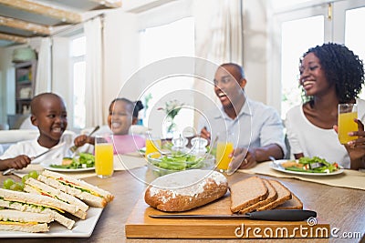 Happy family enjoying a healthy meal together Stock Photo