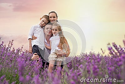 Happy family of four in lavender field Stock Photo