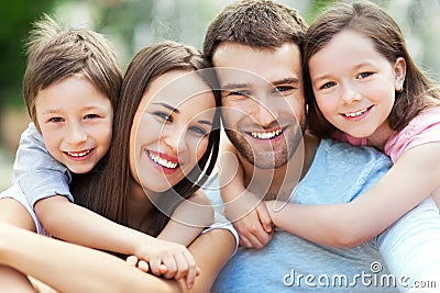 Happy family of four Stock Photo