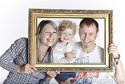 Happy family framed by a picture frame Stock Photo