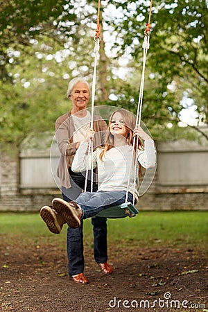 Happy family in front of house outdoors Stock Photo