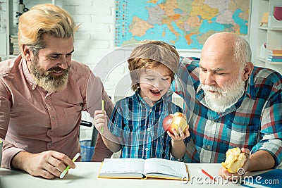 Happy family grandfather father and son toddler play and learning. Father teaching son. Grandfather educated Grandson Stock Photo