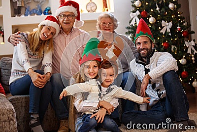 Family with grandmother and grandfather celebrating Christmas Stock Photo