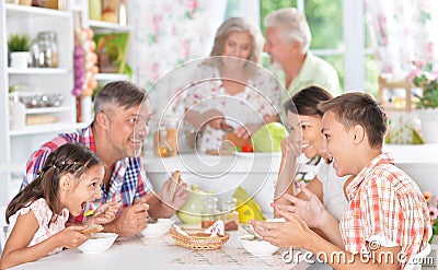 Happy family having breakfast Stock Photo