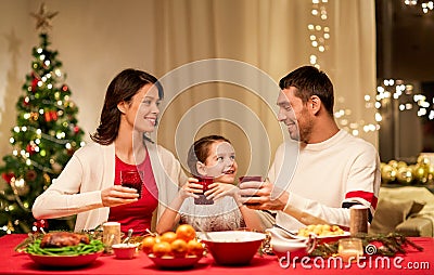 Happy family having christmas dinner at home Stock Photo