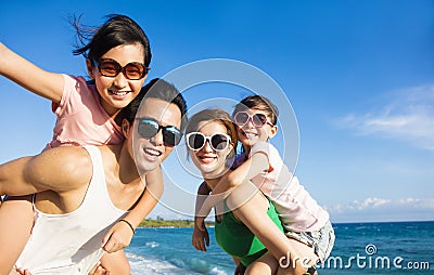 Happy Family Having Fun at the Beach Stock Photo