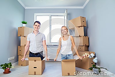 A happy family is having fun in a new apartment at home. Stock Photo