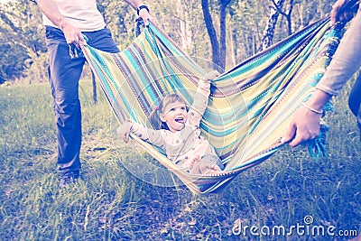 Happy family having fun in a park Stock Photo