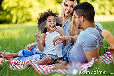 Happy family having fun time on picnic Stock Photo