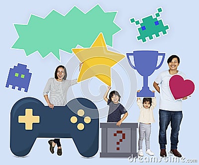 Happy family holding gaming icons Stock Photo