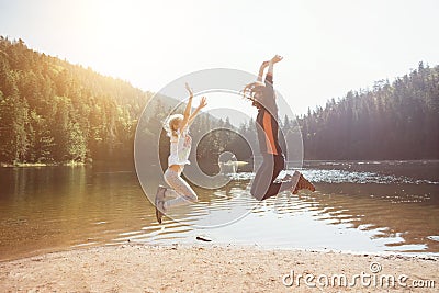 Happy family at the lake Synevyr Stock Photo