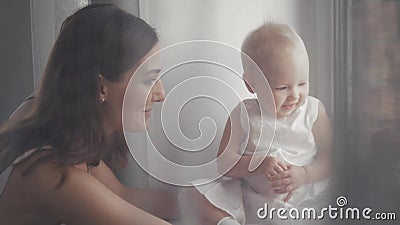 Happy family laughing faces, mother holding adorable child baby boy, smiling and hugging, close up border, beauty of Stock Photo