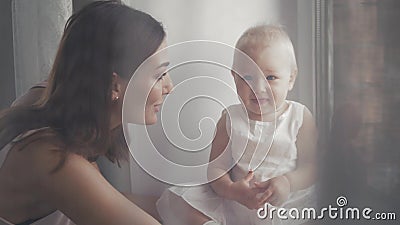 Happy family laughing faces, mother holding adorable child baby boy, smiling and hugging, close up border, beauty of Stock Photo