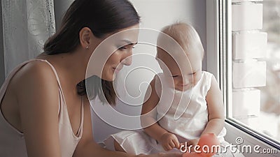 Happy family laughing faces, mother holding adorable child baby boy, smiling and hugging, close up border, beauty of Stock Photo