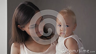 Happy family laughing faces, mother holding adorable child baby boy, smiling and hugging, close up border, beauty of Stock Photo