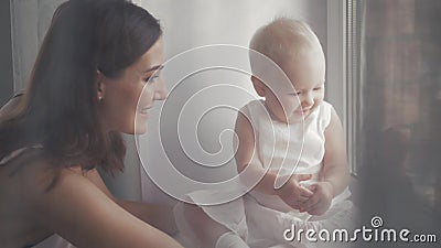 Happy family laughing faces, mother holding adorable child baby boy, smiling and hugging, close up border, beauty of Stock Photo