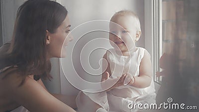 Happy family laughing faces, mother holding adorable child baby boy, smiling and hugging, close up border, beauty of Stock Photo