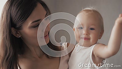 Happy family laughing faces, mother holding adorable child baby boy, smiling and hugging, close up border, beauty of Stock Photo