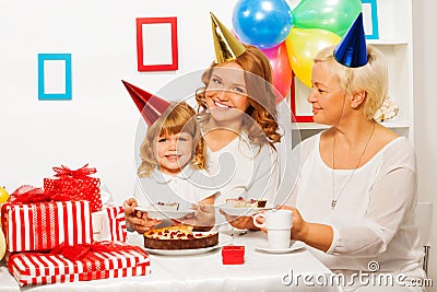 Happy family at little girl birthday party Stock Photo