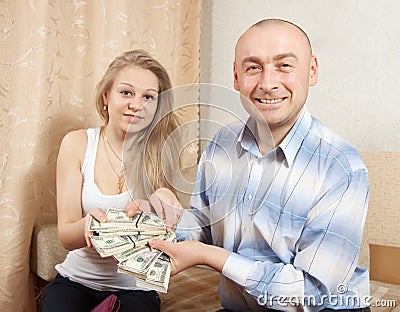 Happy family with many US dollars Stock Photo