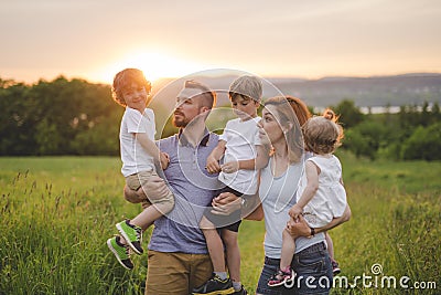 Happy family in the meadow Stock Photo