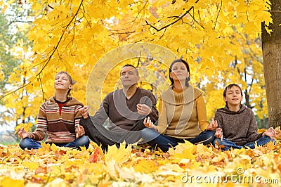 Happy family meditate Stock Photo