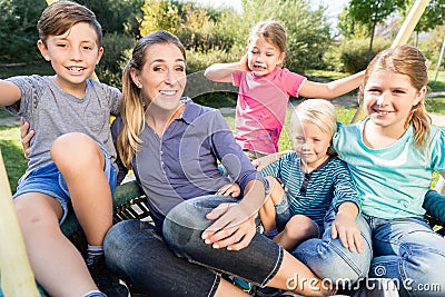 Family with mom, sons and daughters taking photo together Stock Photo