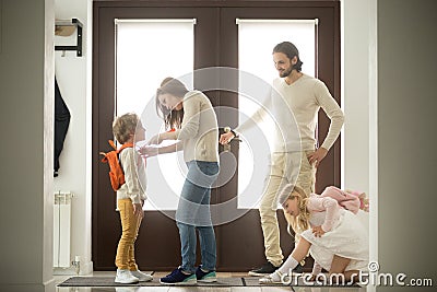 Happy family morning preparations, parents getting kids ready fo Stock Photo