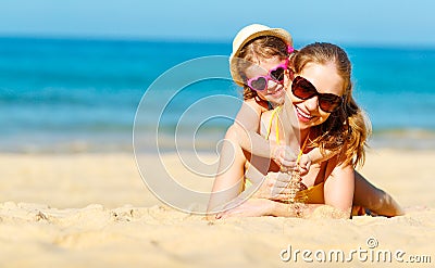 Happy family mother and child daughter on beach in summer Stock Photo