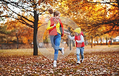 Happy family mother and child daughter on autumn walk Stock Photo