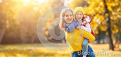 Happy family mother and child daughter on autumn walk Stock Photo