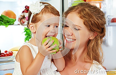 happy family mother and child with healthy food fruits and vegetables Stock Photo