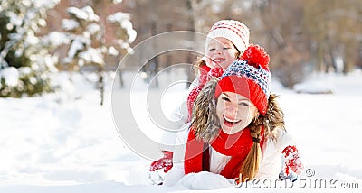 Happy family mother and child playing on winter walk Stock Photo