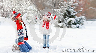 Happy family mother and child playing on winter walk Stock Photo