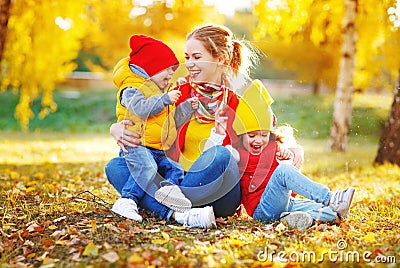 Happy family mother and children on autumn walk Stock Photo