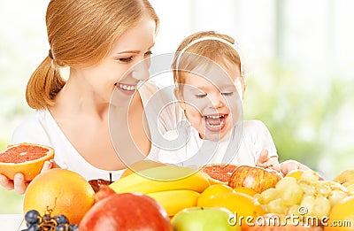 happy family mother and daughter little girl, eat healthy vegetarian food, fruit Stock Photo