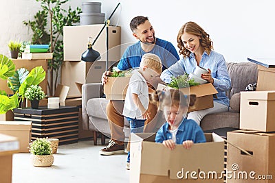 Happy family mother father and children move to new apartment an Stock Photo