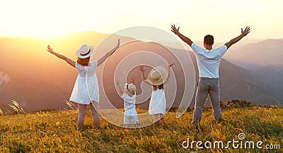 Happy family: mother, father, children son and daughter on sunset Stock Photo