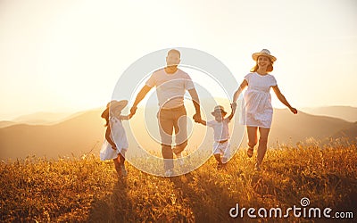 Happy family: mother, father, children son and daughter on sunset Stock Photo