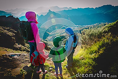 Happy family -mother with kids- travel in sunset mountains Stock Photo