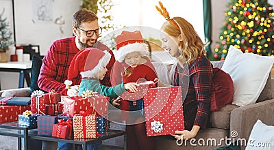 Happy family open presents on Christmas morning Stock Photo