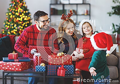 Happy family open presents on Christmas morning Stock Photo